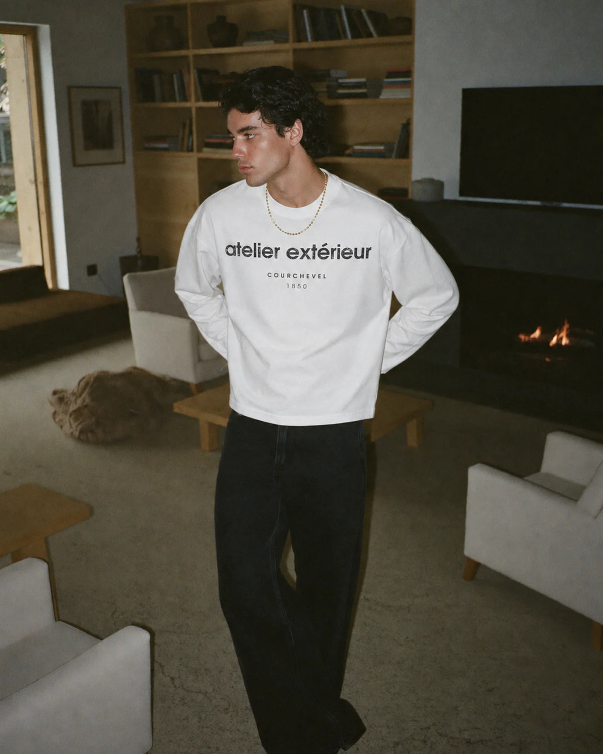 Man wearing the 1850 Long Sleeve Tee in white, on location