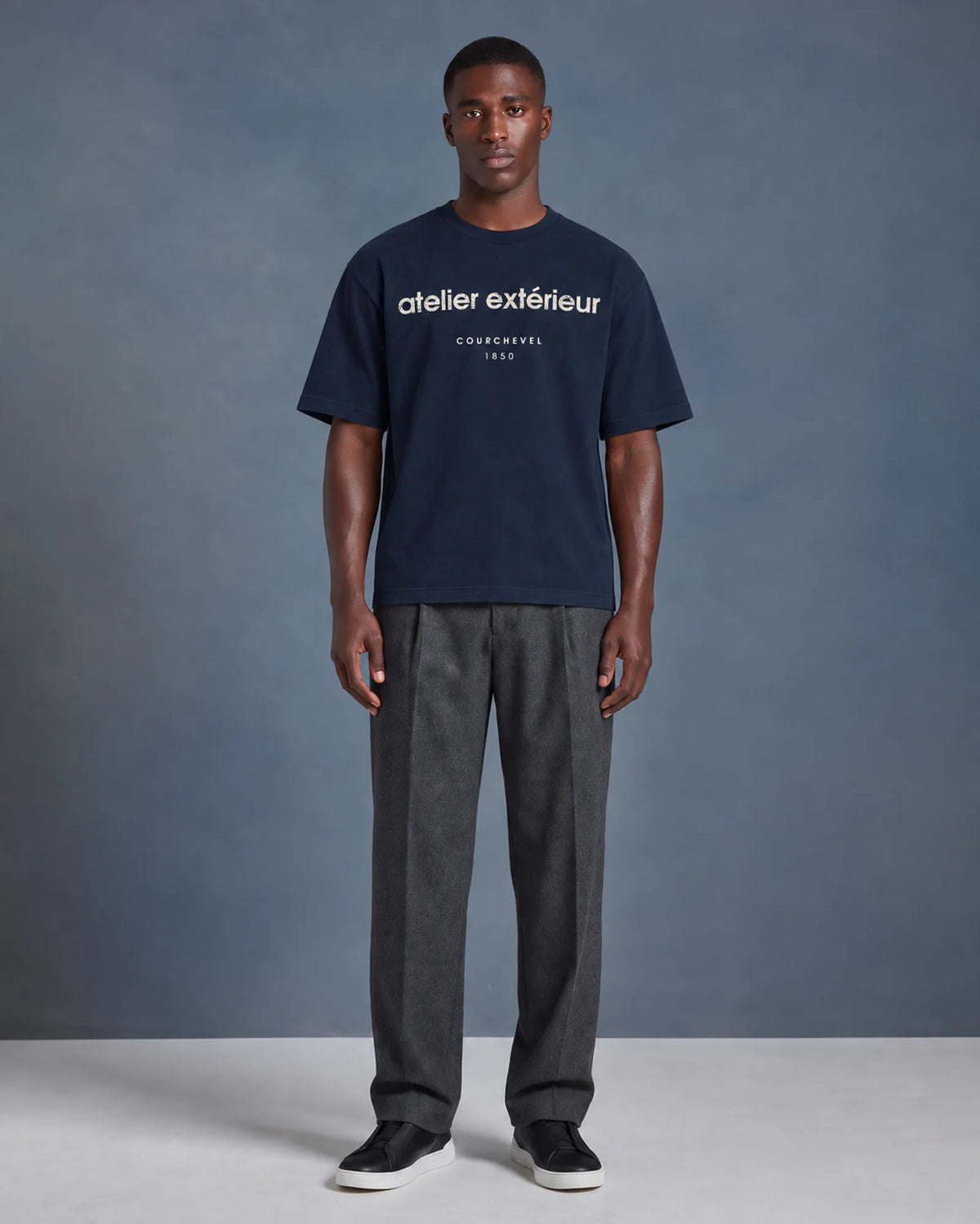 Studio model wearing the navy Courchevel 1850 ski tee