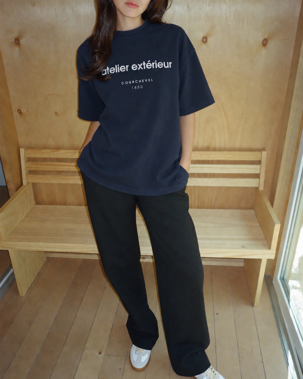 Woman wearing the 1850 Tee in navy, on location