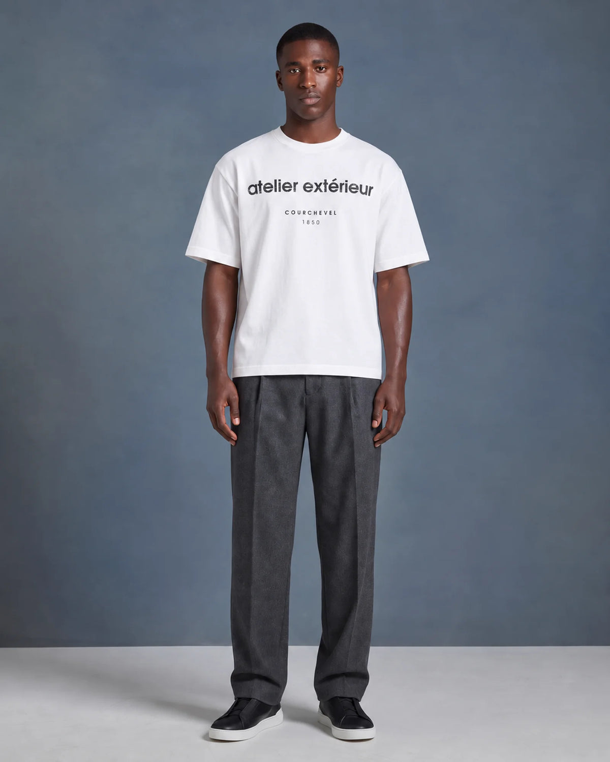 Studio model wearing the white Courchevel 1850 ski tee