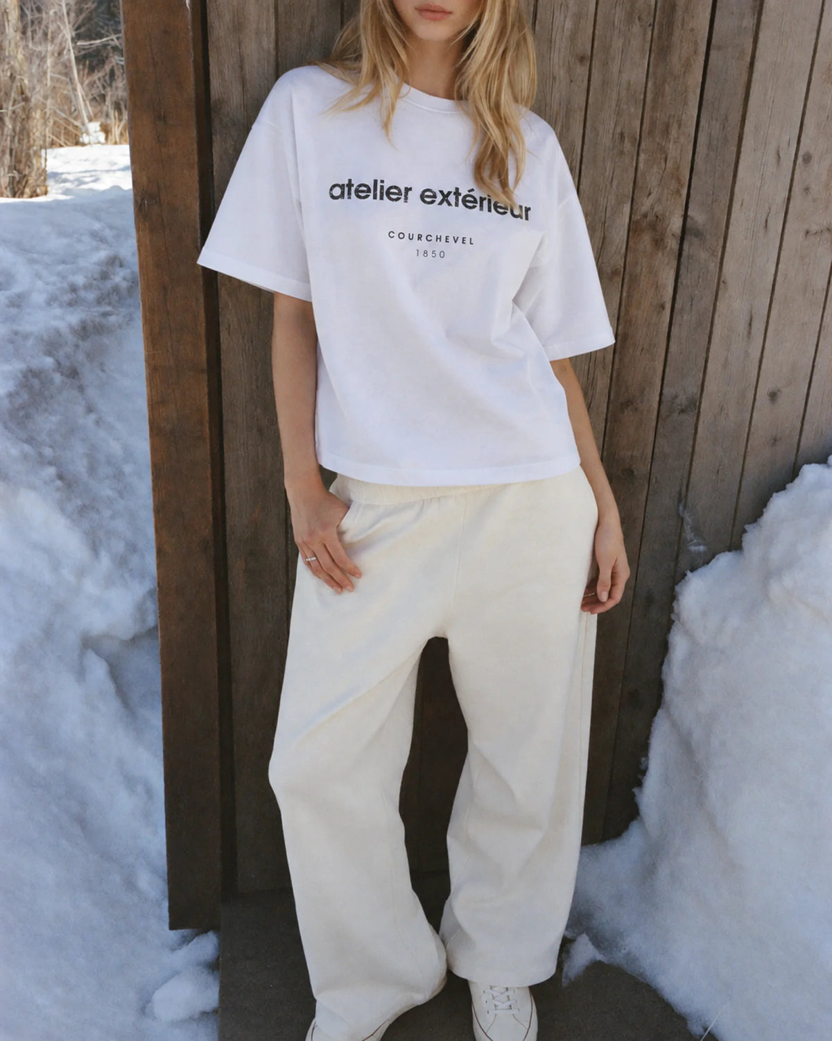 Woman wearing the 1850 Tee in white, on location