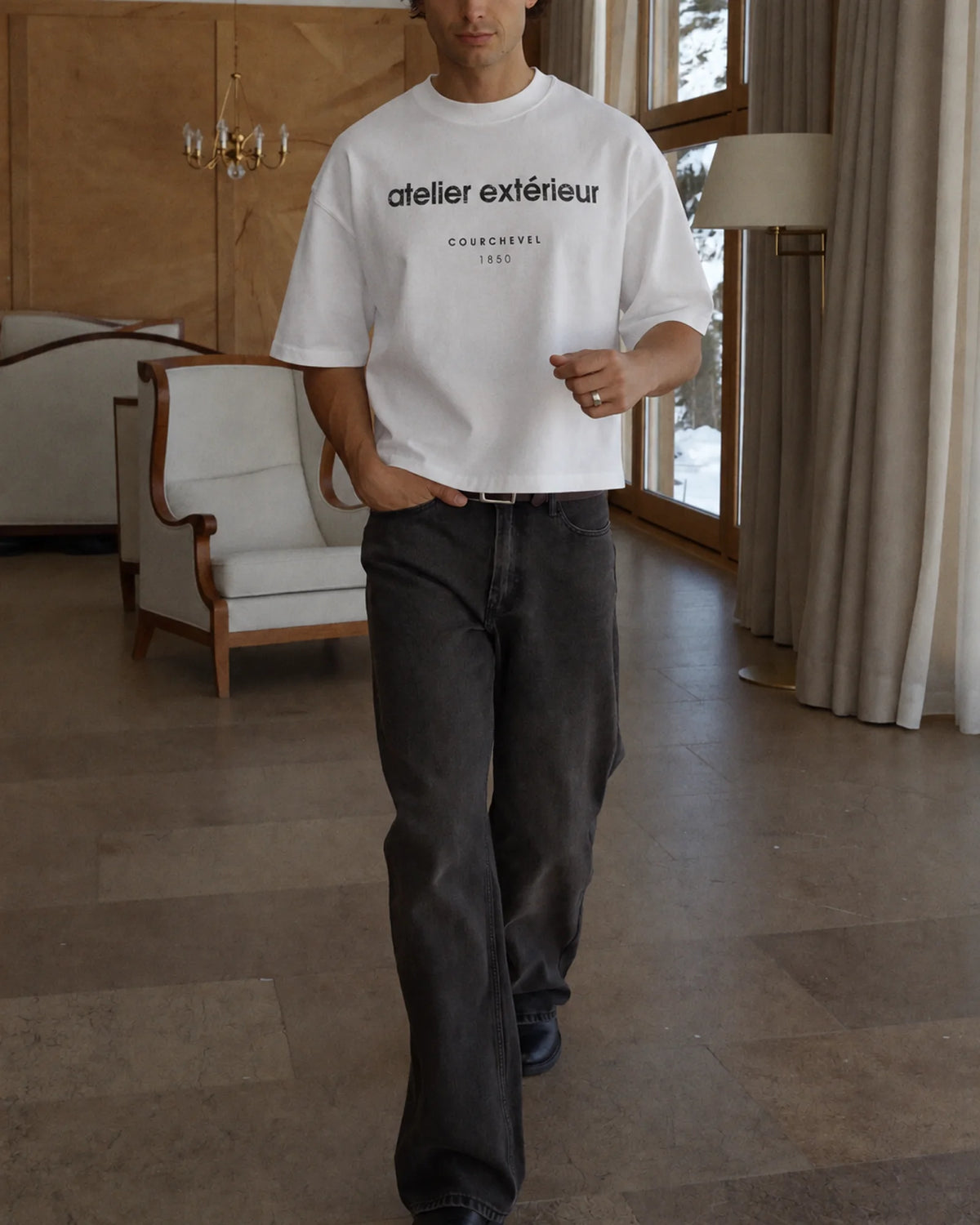 Man wearing the 1850 Tee in white, on location