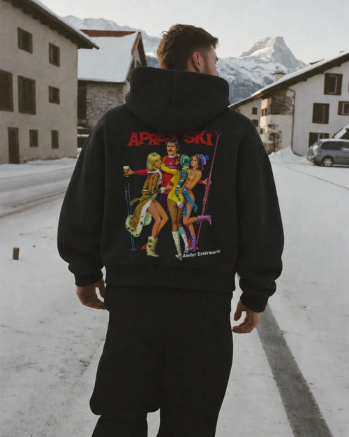 Man wearing the Après Ski Hoodie in black, on location