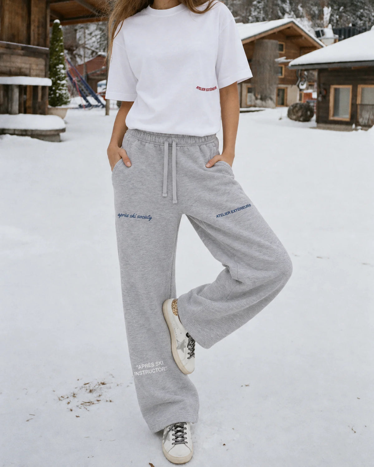 Woman wearing the Après Ski Instructor Sweatpants - Straight Leg in heather gray, on location