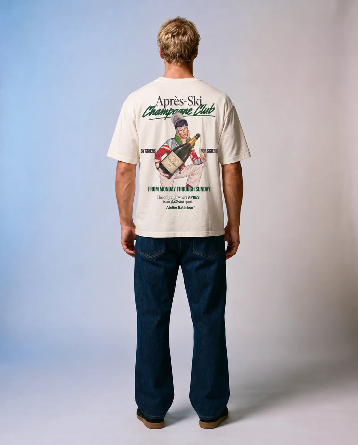Studio model wearing the ecru Champagne Club ski tee, back view