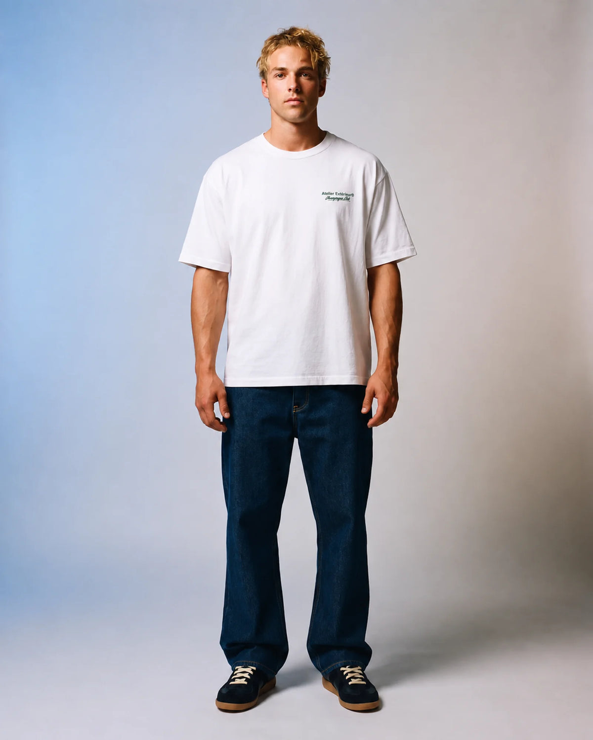 Studio model wearing the white Champagne Club ski tee, front view