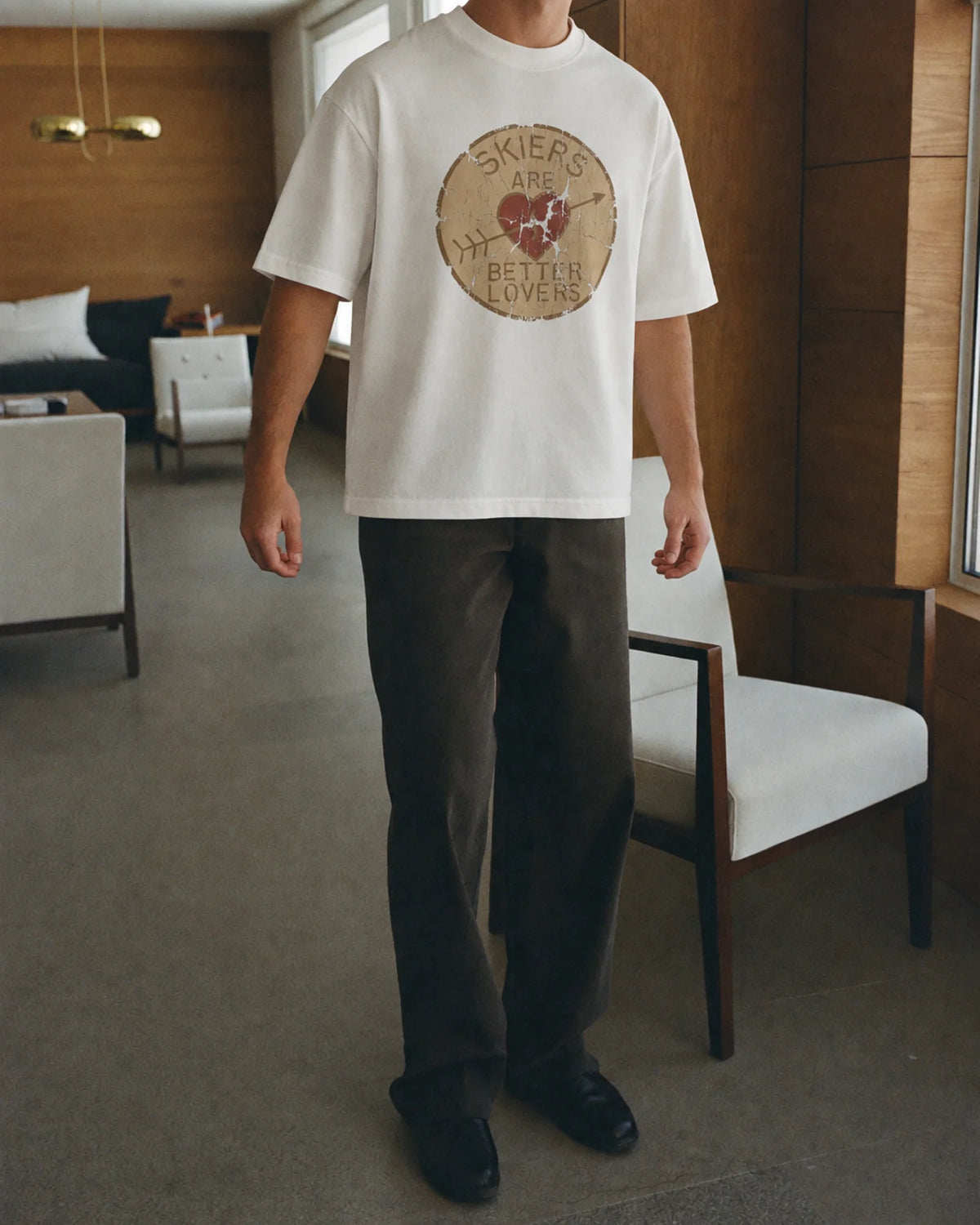 Man wearing the Better Lovers Tee, on location