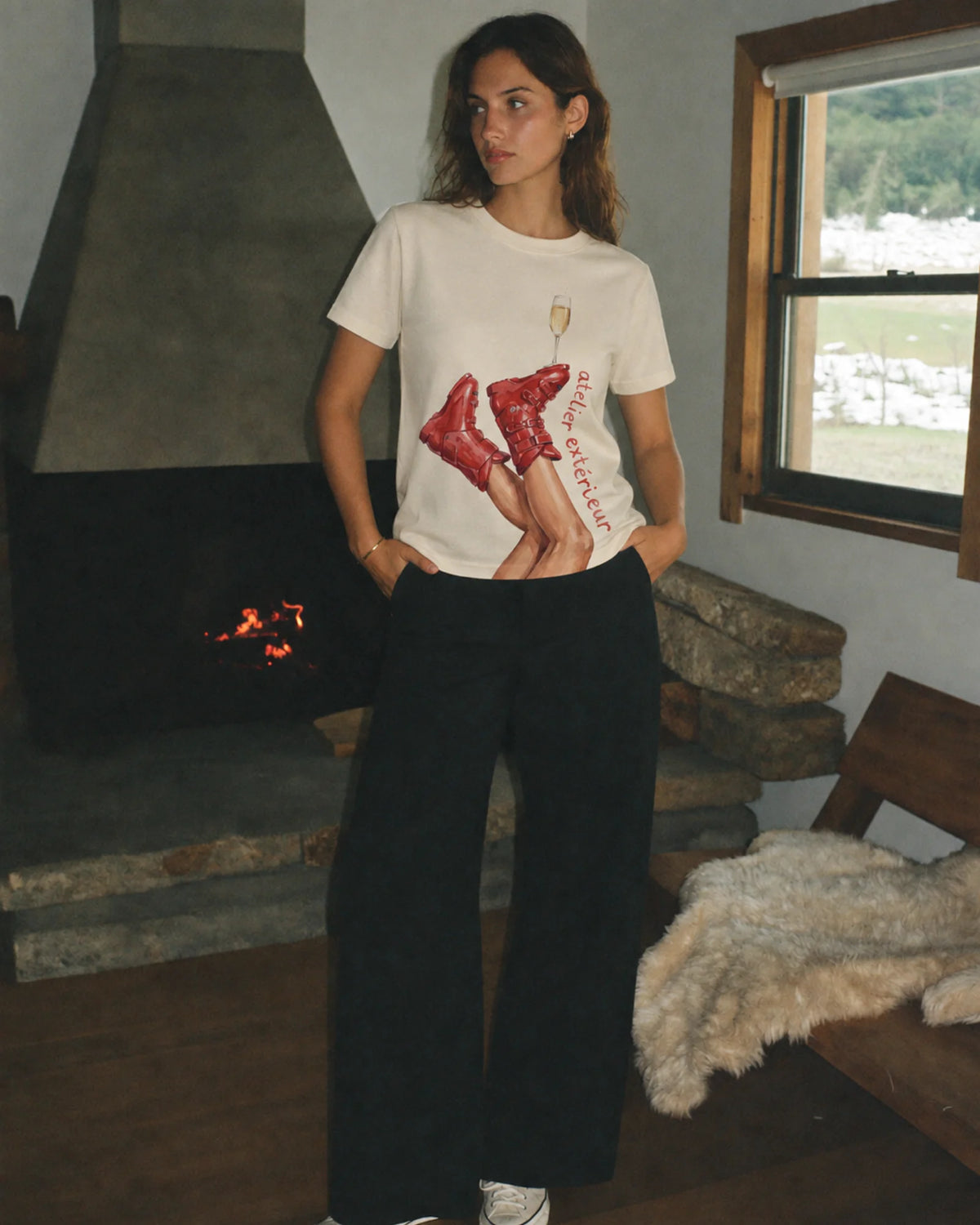 Woman wearing the Champagne Women's Tee in ecru, on location