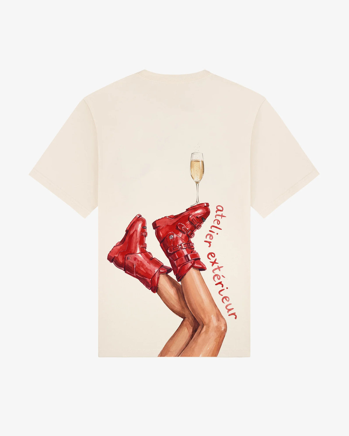 Champagne women's tee in ecru, back view, red ski boots with a champagne flute balanced on the toe