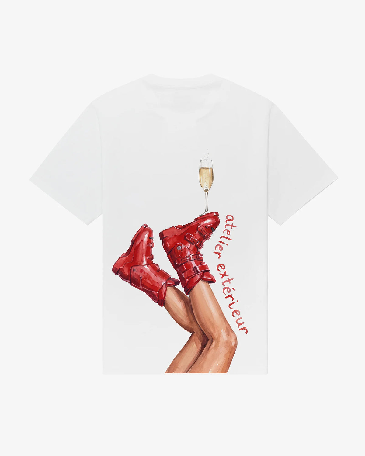 Champagne women's tee in white, back view, red ski boots with a champagne flute balanced on the toe
