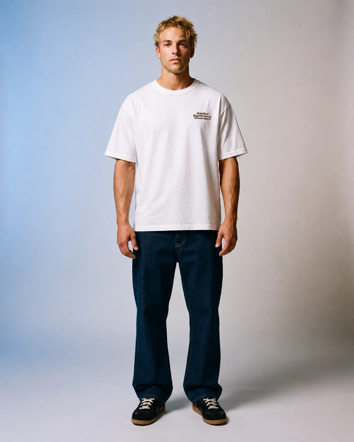 Model wearing the white Charters tee in a studio, front view