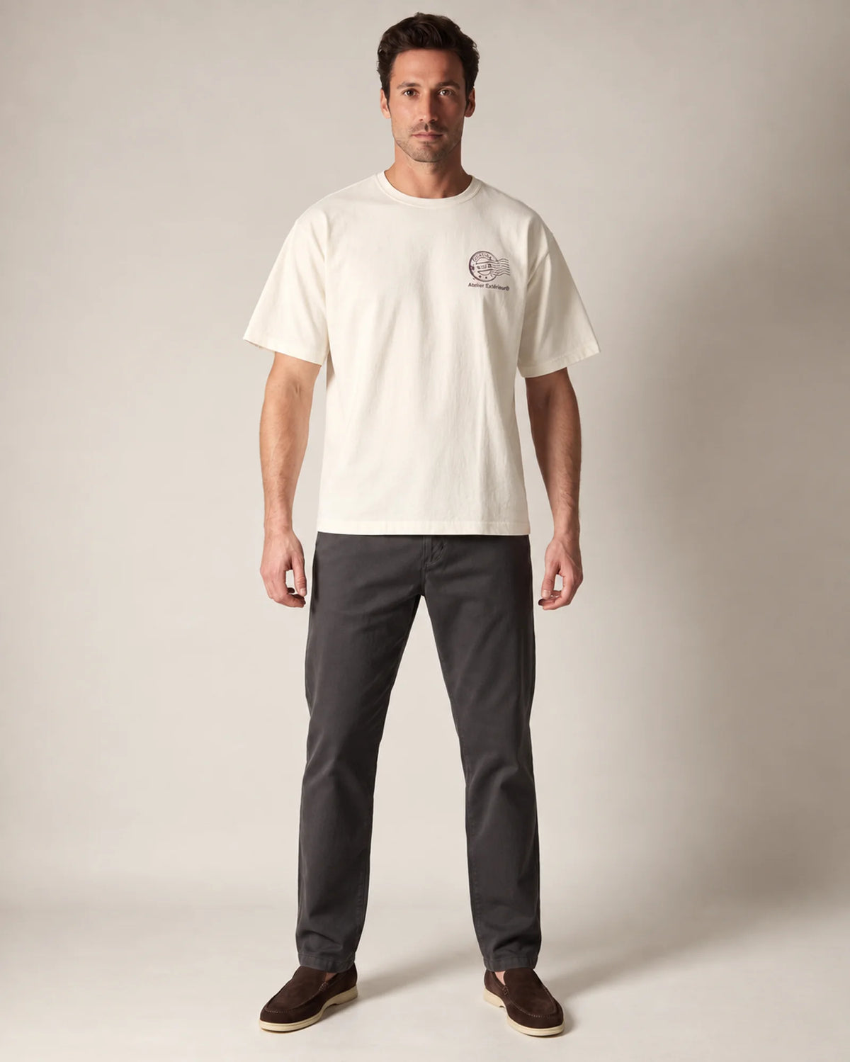 Model wearing the ecru Cortina tee in a studio, front view