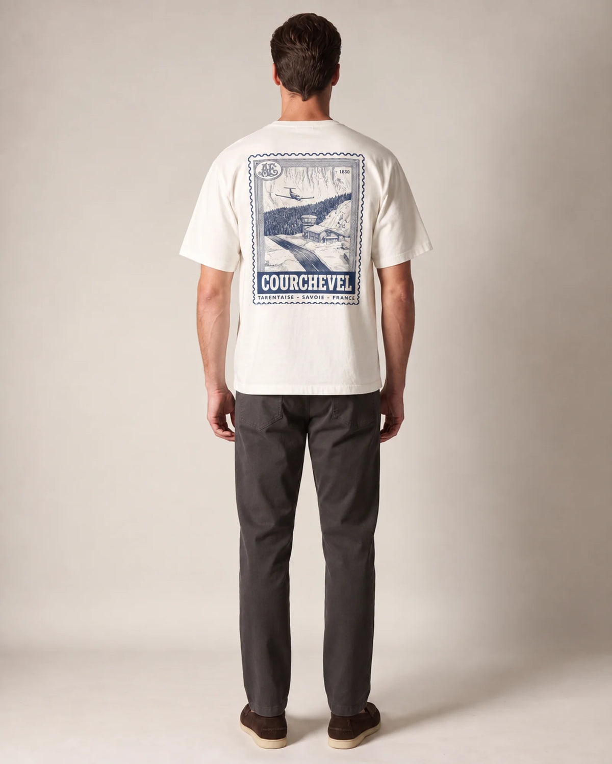 Model wearing the ecru Courchevel tee in a studio, back view