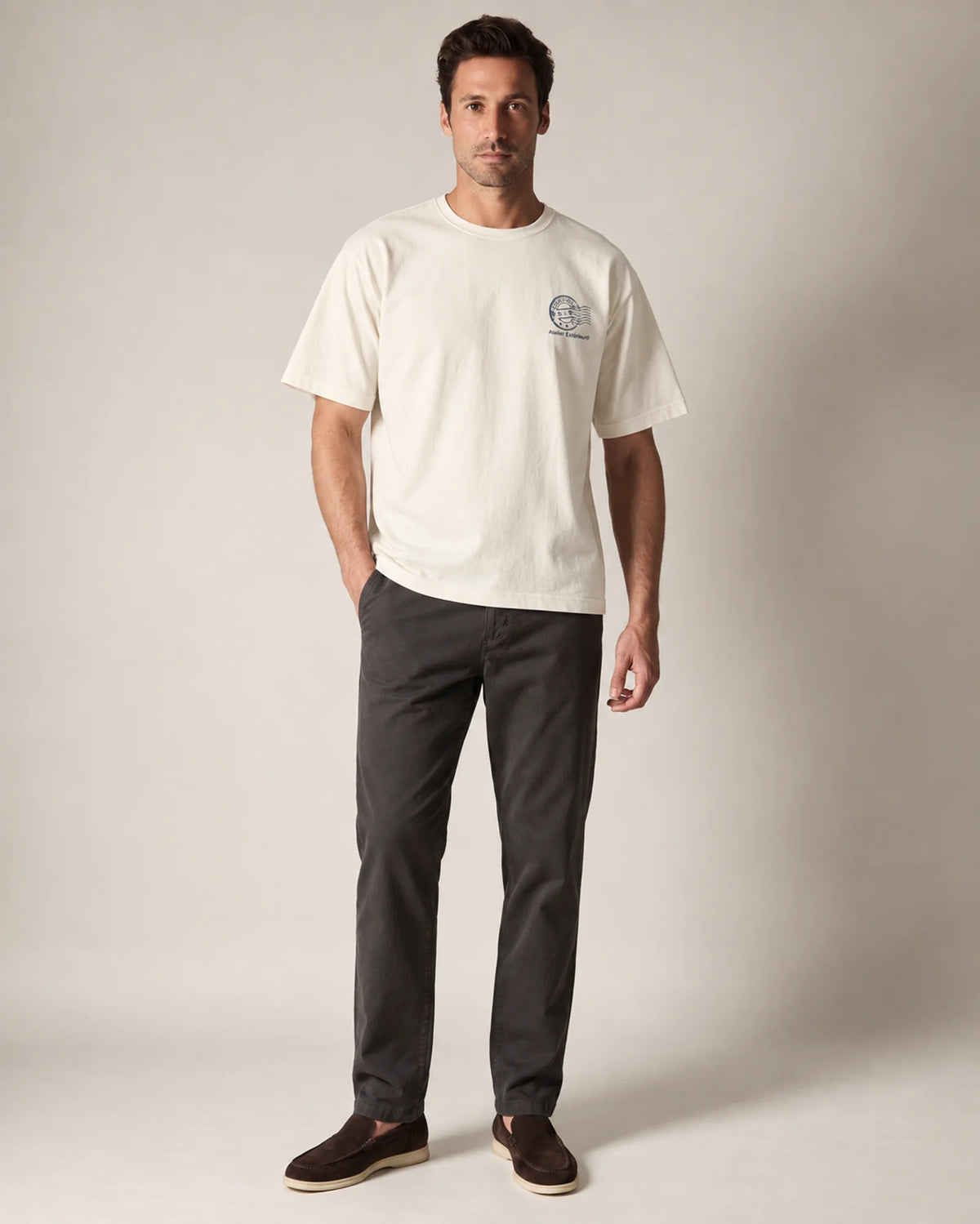 Model wearing the ecru Courchevel tee in a studio, front view