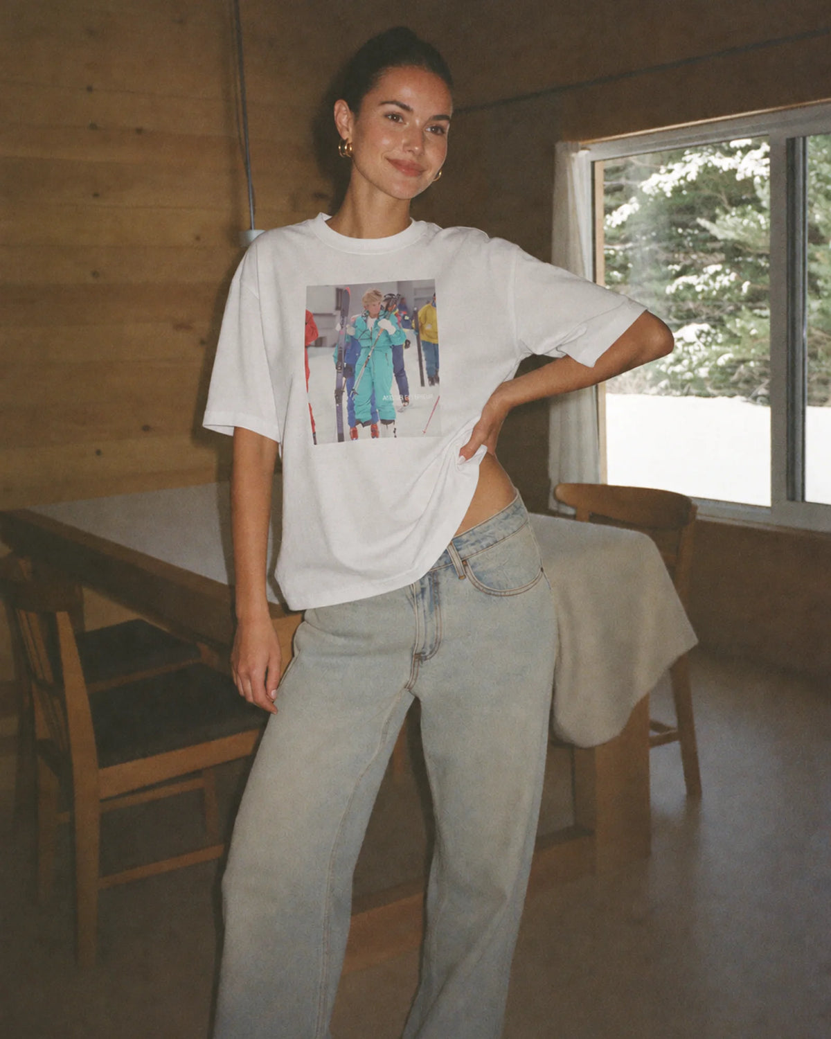 Woman wearing the white Diana tee outdoors, front view
