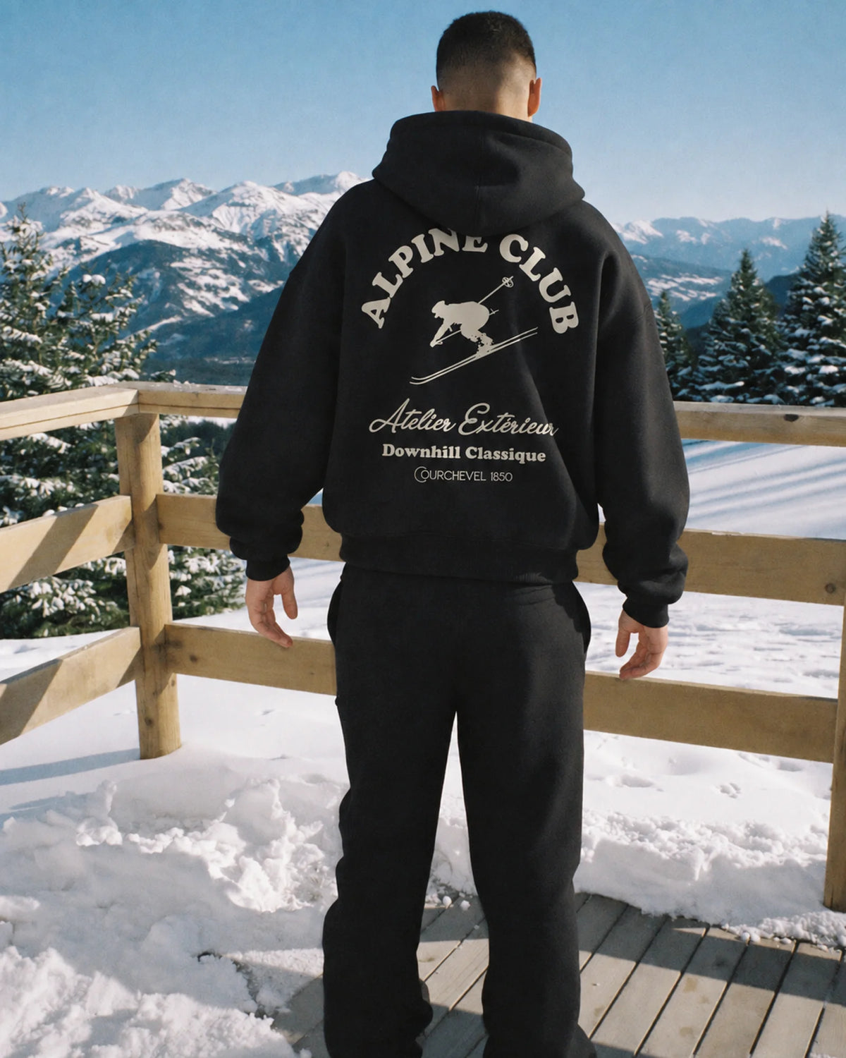 Man wearing the Downhill Classique Hoodie, on location