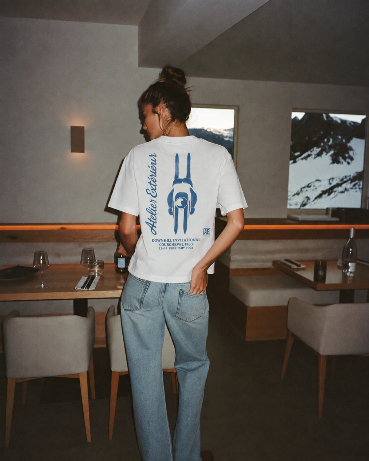 Woman wearing the Downhill Invitational Tee, on location