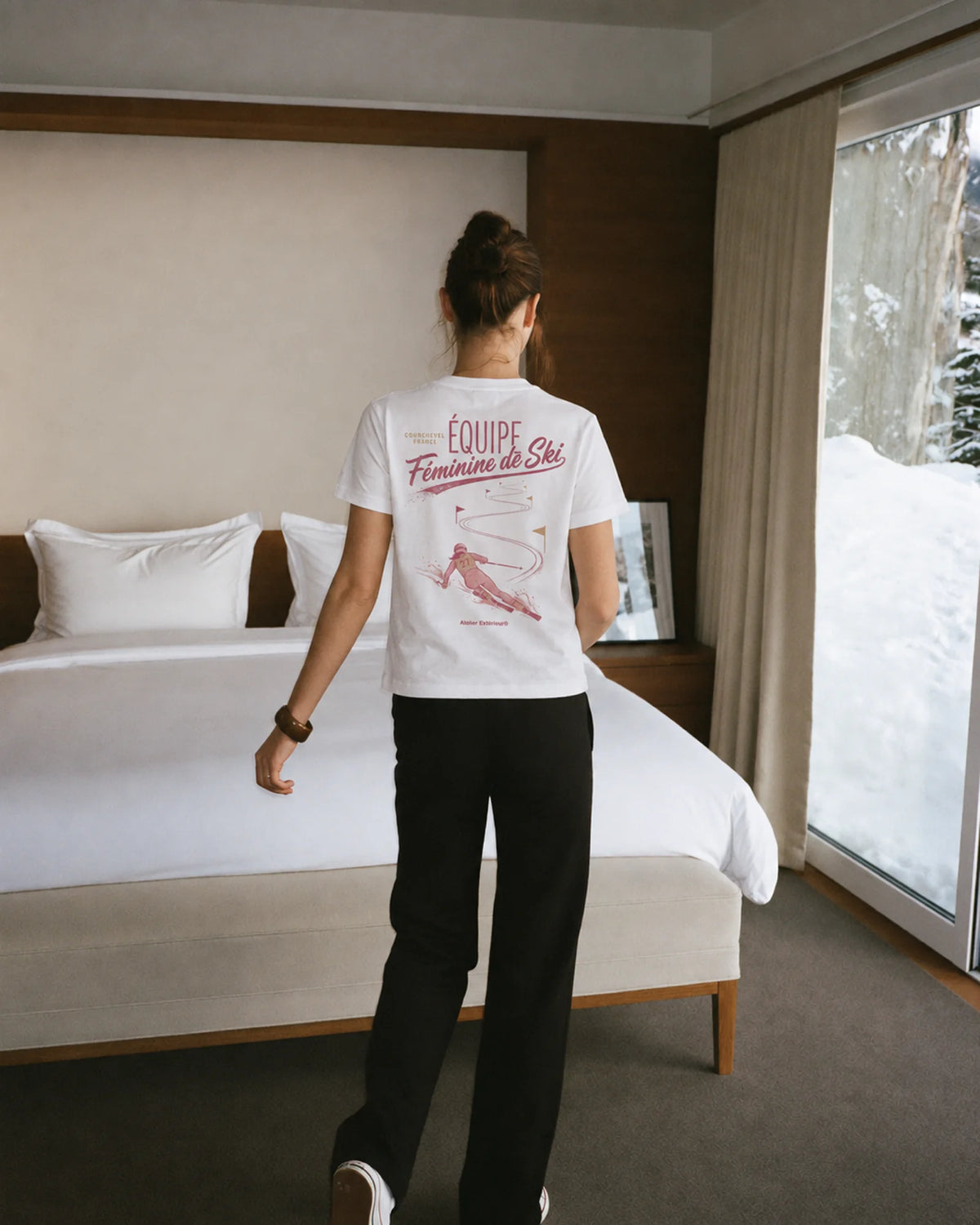 Woman wearing the Équipe Féminine de Ski Women's Tee, on location