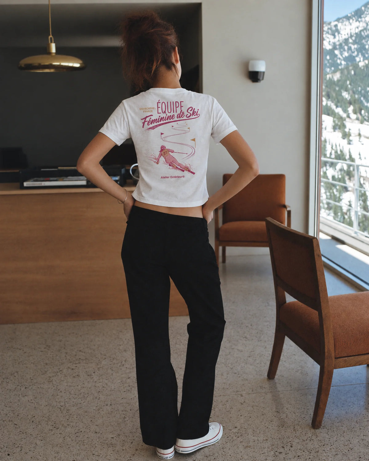 Woman wearing the Équipe Féminine de Ski Women's Tee, on location