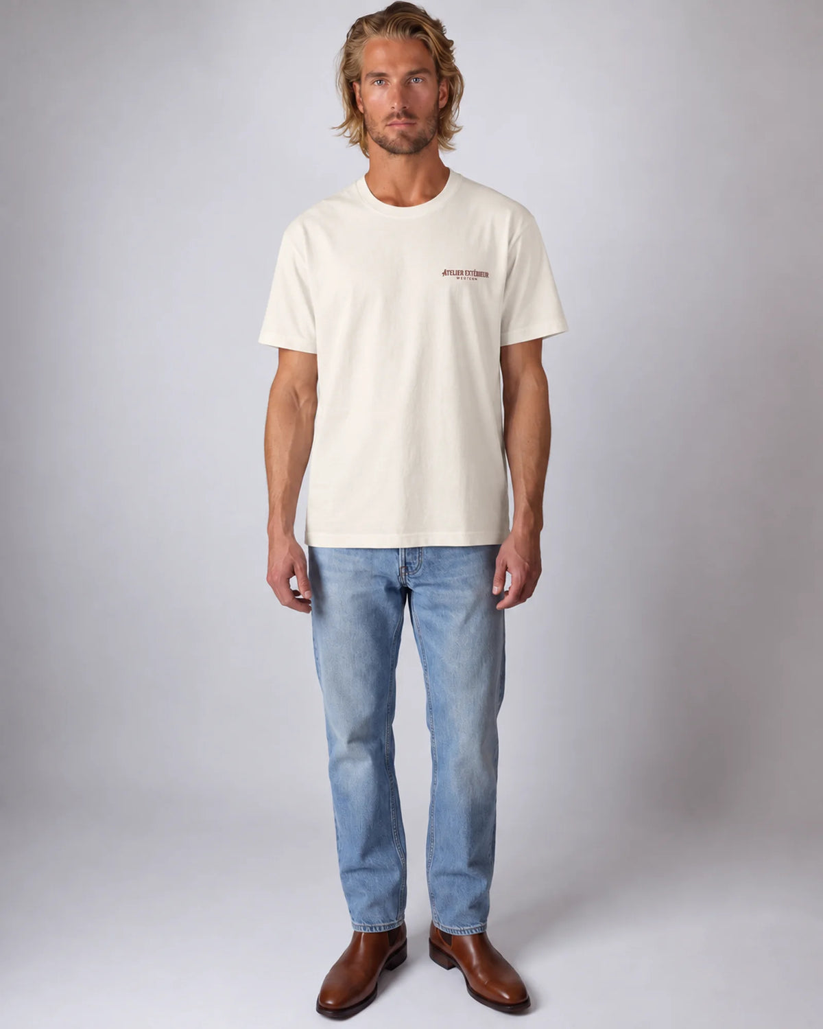 Model wearing the ecru Full Service tee in a studio, front view