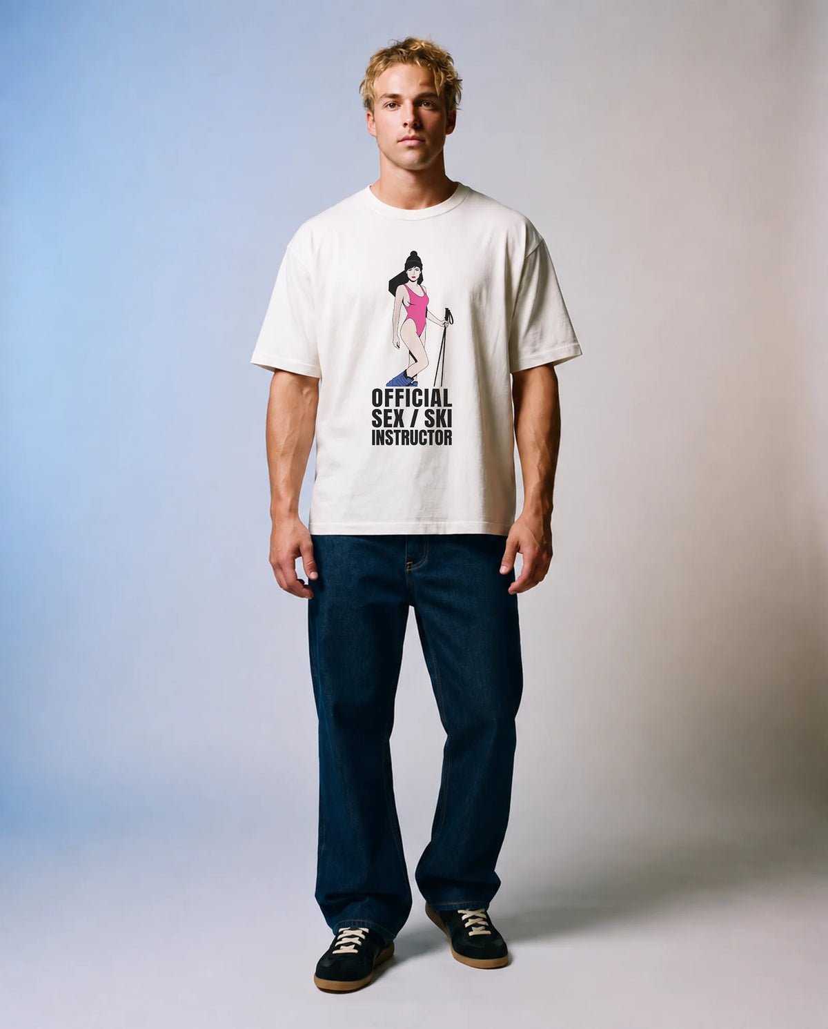 Model wearing the white Instructor tee in a studio, front view
