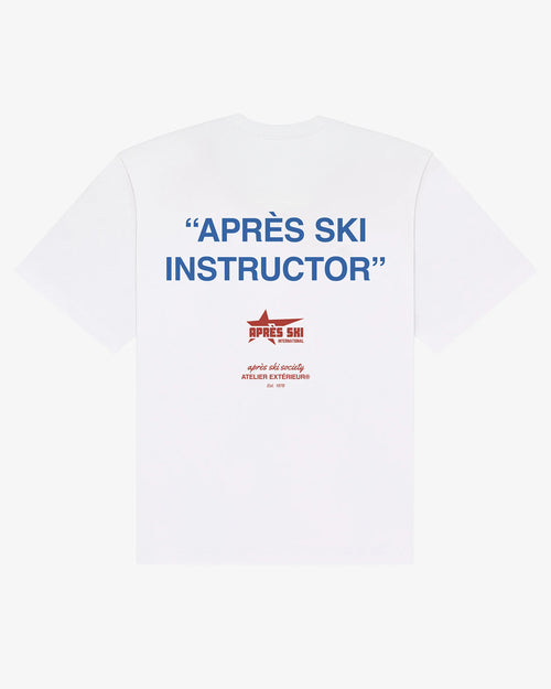 White Après Ski Instructor tee, back print, flat lay - Atelier Extérieur