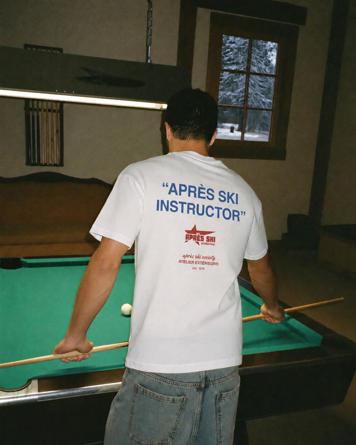 White Après Ski Instructor tee worn après ski