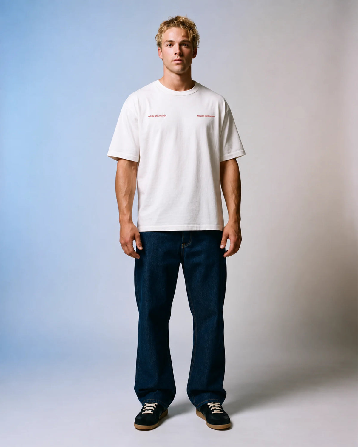 Studio model wearing the white Après Ski Instructor tee, front view