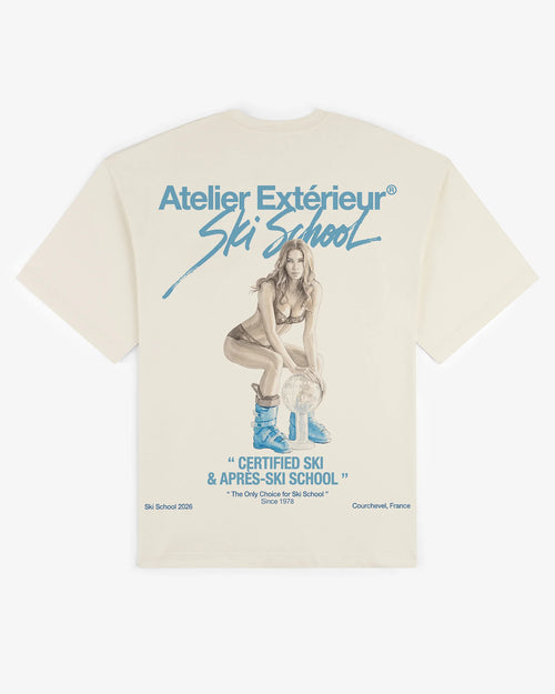Ecru cotton Julia tee, back view, with a hand-painted Ski School illustration in blue