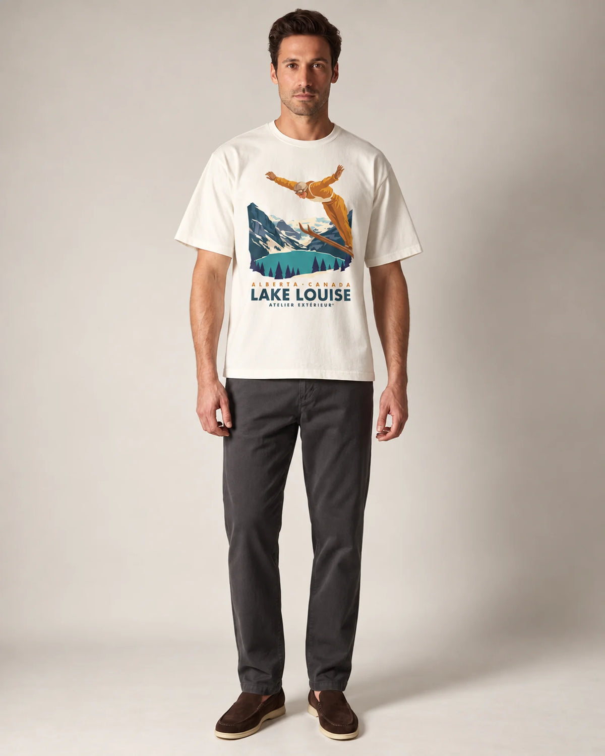 Model wearing the ecru Lake Louise tee in a studio, front view