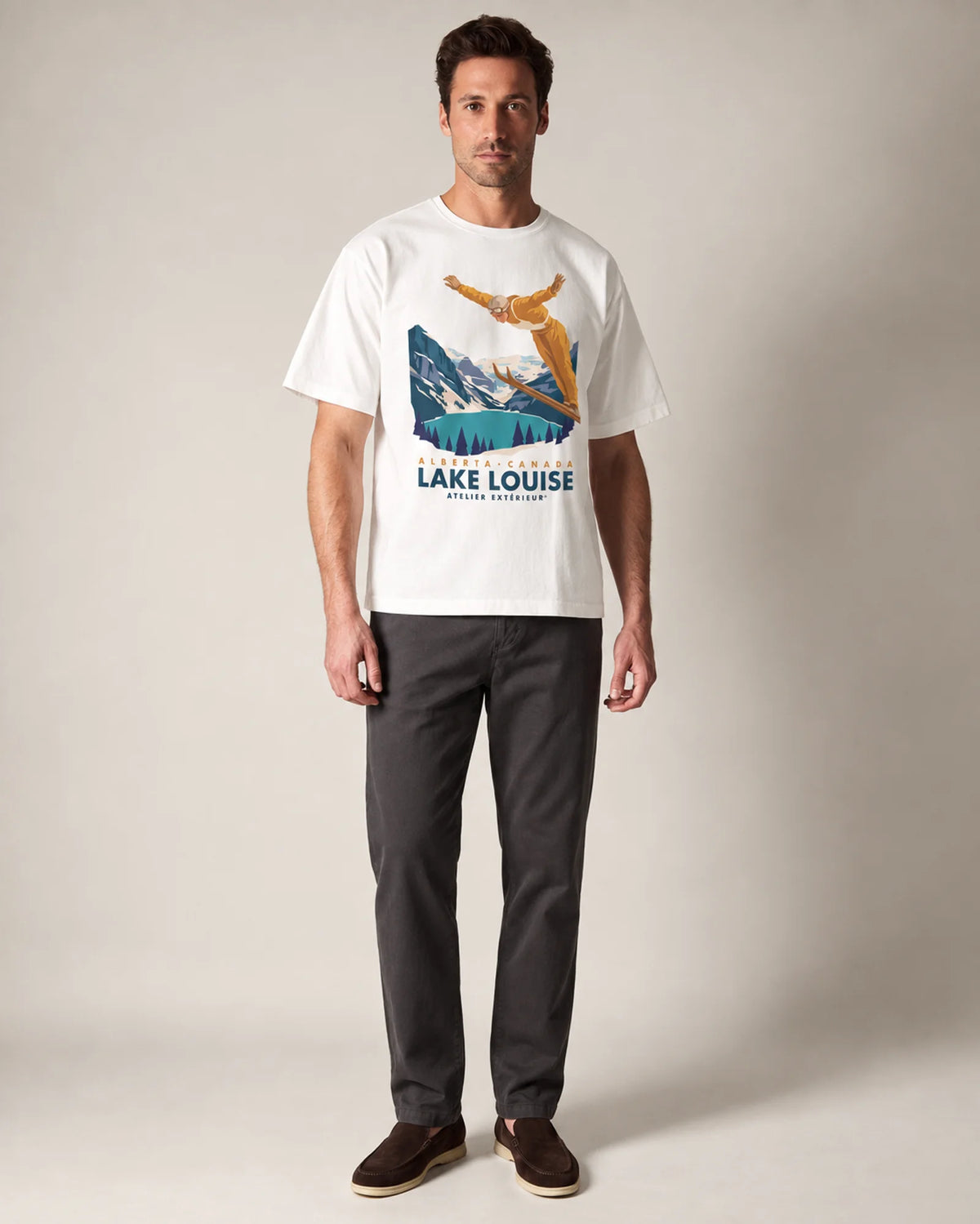 Model wearing the white Lake Louise tee in a studio, front view
