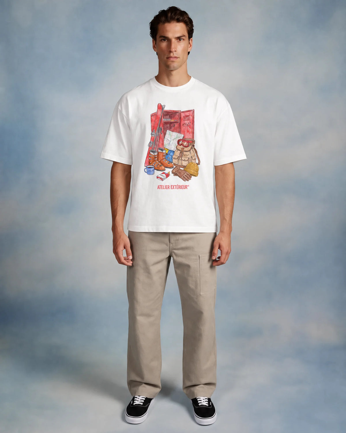 Model wearing the white Locker tee in a studio, front view