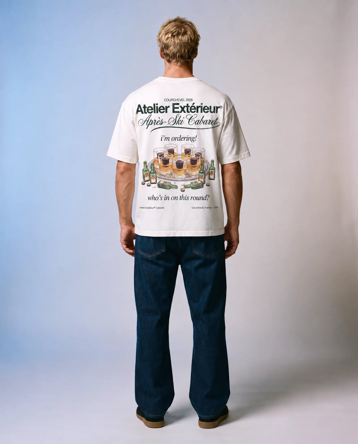 Model wearing the white My Round tee in a studio, back view