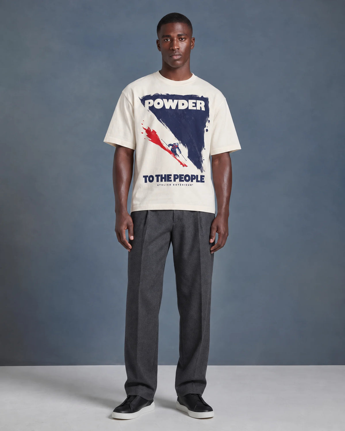 Model wearing the ecru Powder to the People tee in a studio, front view