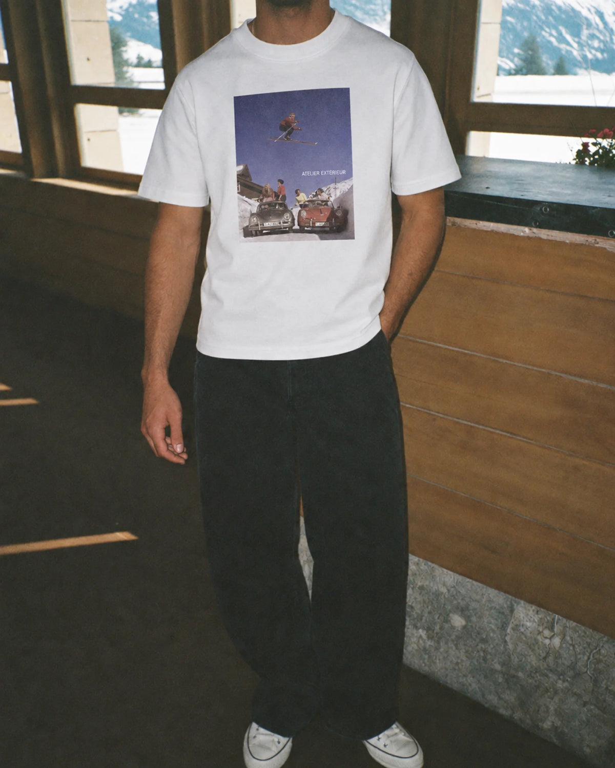 Man wearing the Ski Jump Tee, on location
