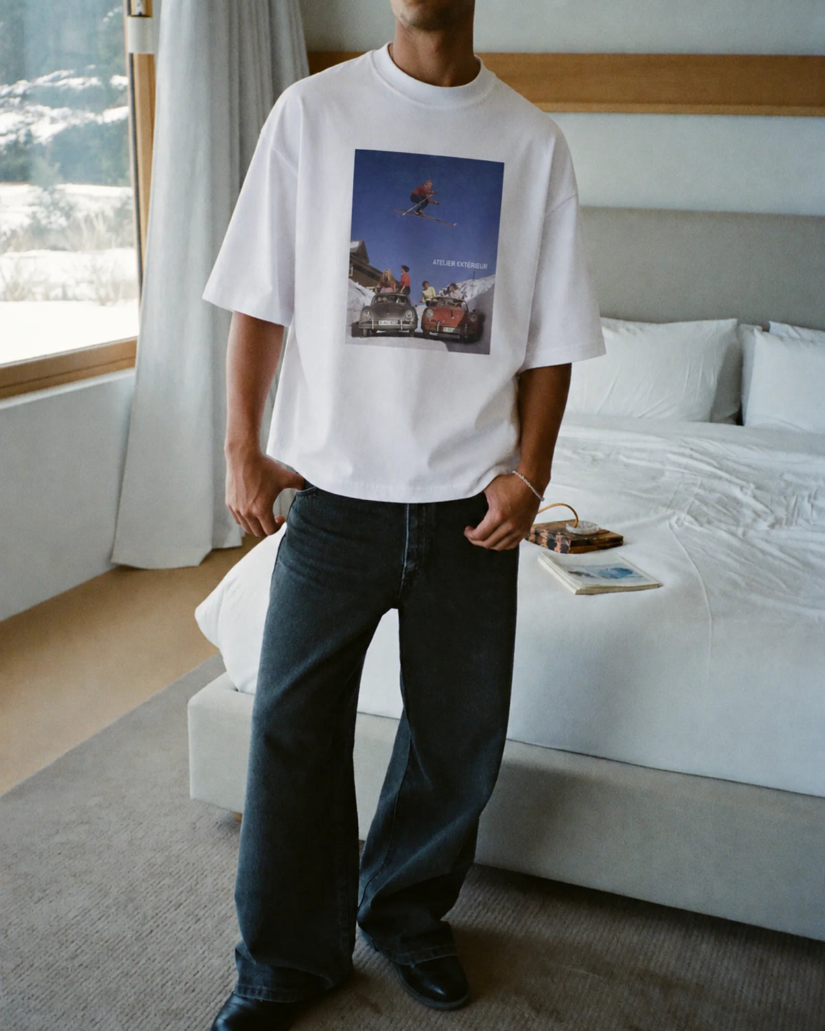 Man wearing the Ski Jump Tee, on location