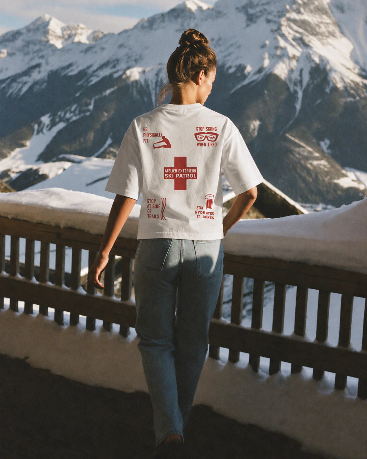 Woman wearing the Ski Patrol Tee, on location