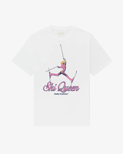 Ski Queen women's tee in white, front view, skier mid-air in a pink one-piece above Ski Queen script