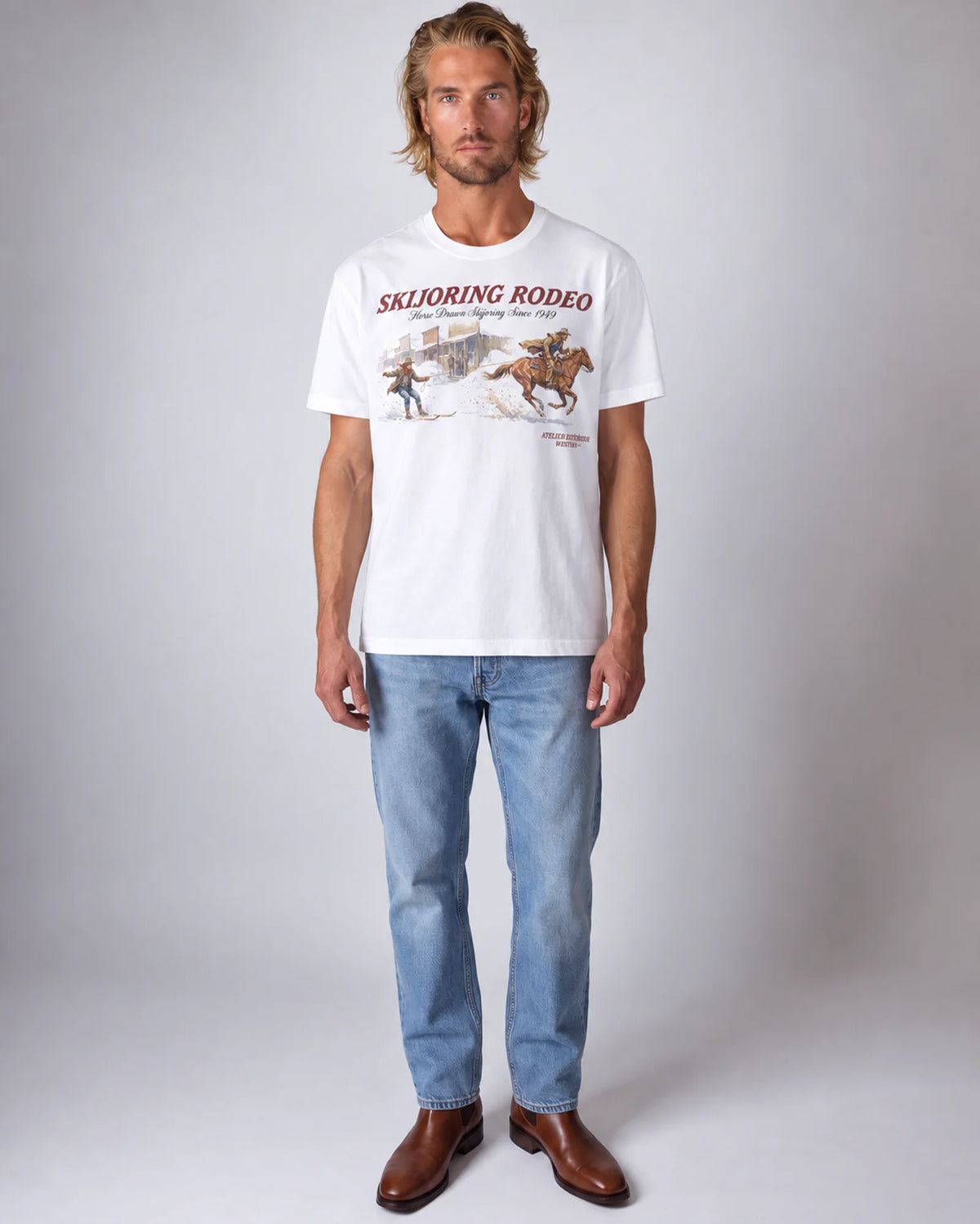 Studio model wearing the white Skijoring tee, front view