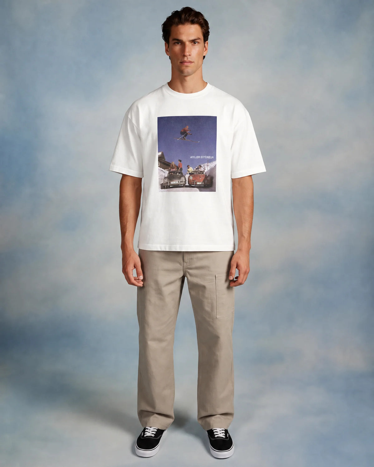 Model wearing the white Ski Jump tee in a studio, front view