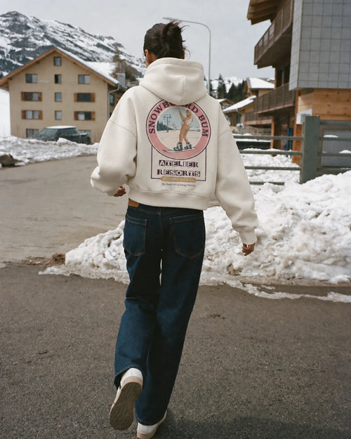 Woman wearing the Snowboard Bum Hoodie, on location