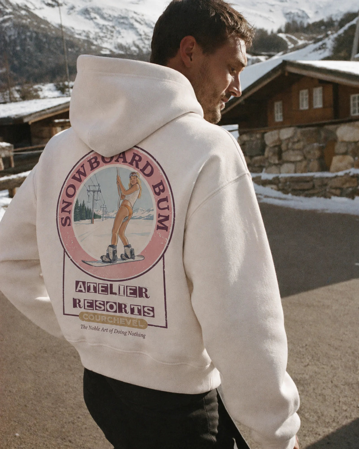 Man wearing the Snowboard Bum Hoodie, on location