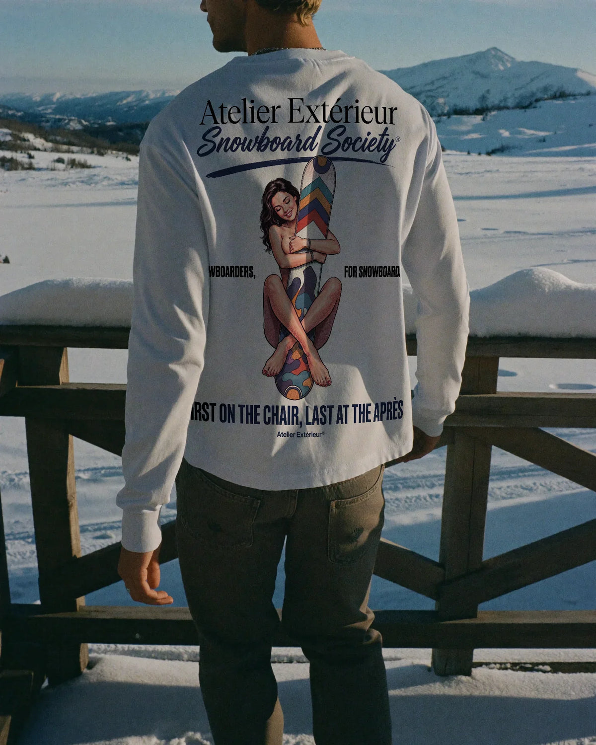 Man wearing the Snowboard Society Long Sleeve Tee, on location
