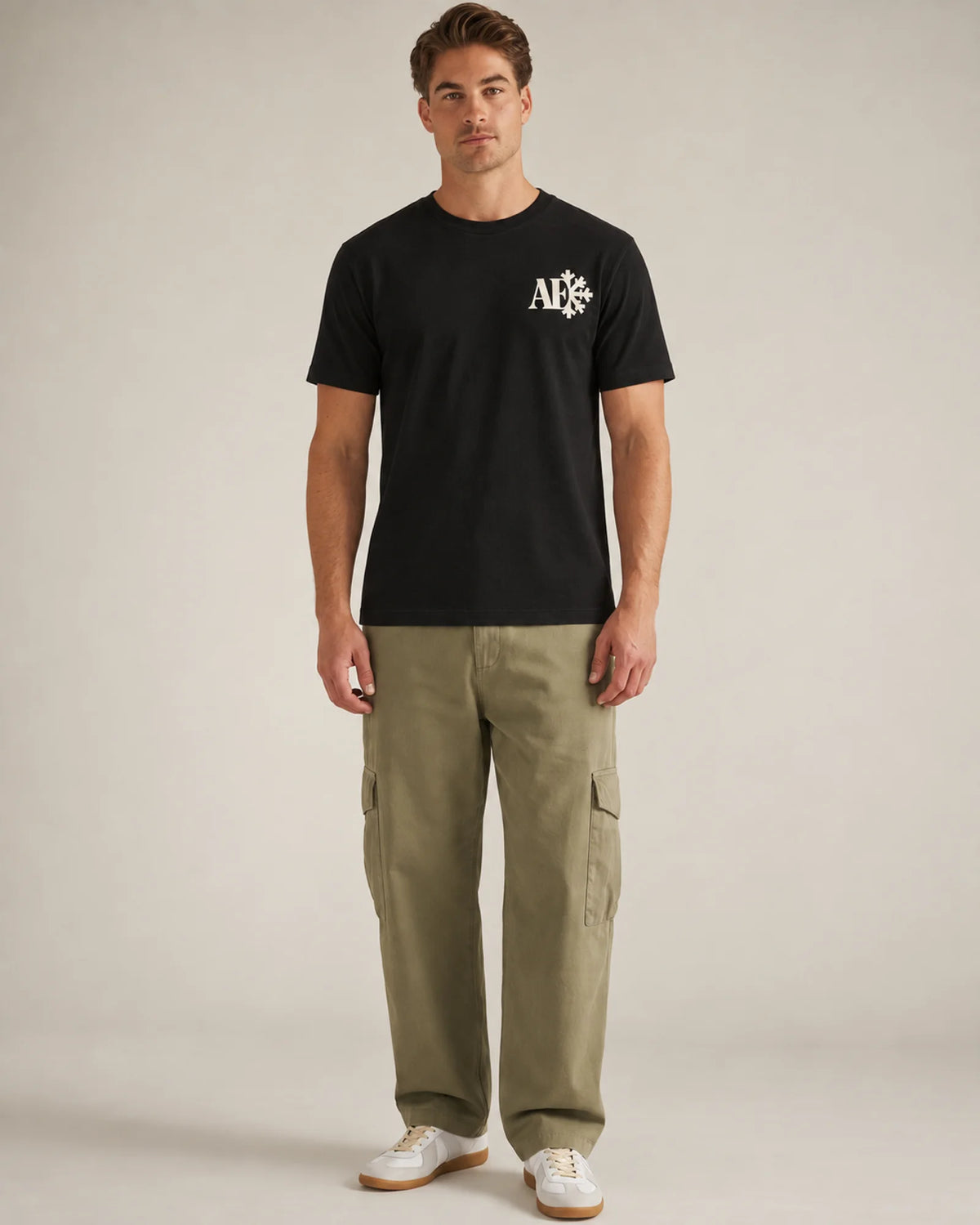Studio model wearing the black Snowflake tee, front view