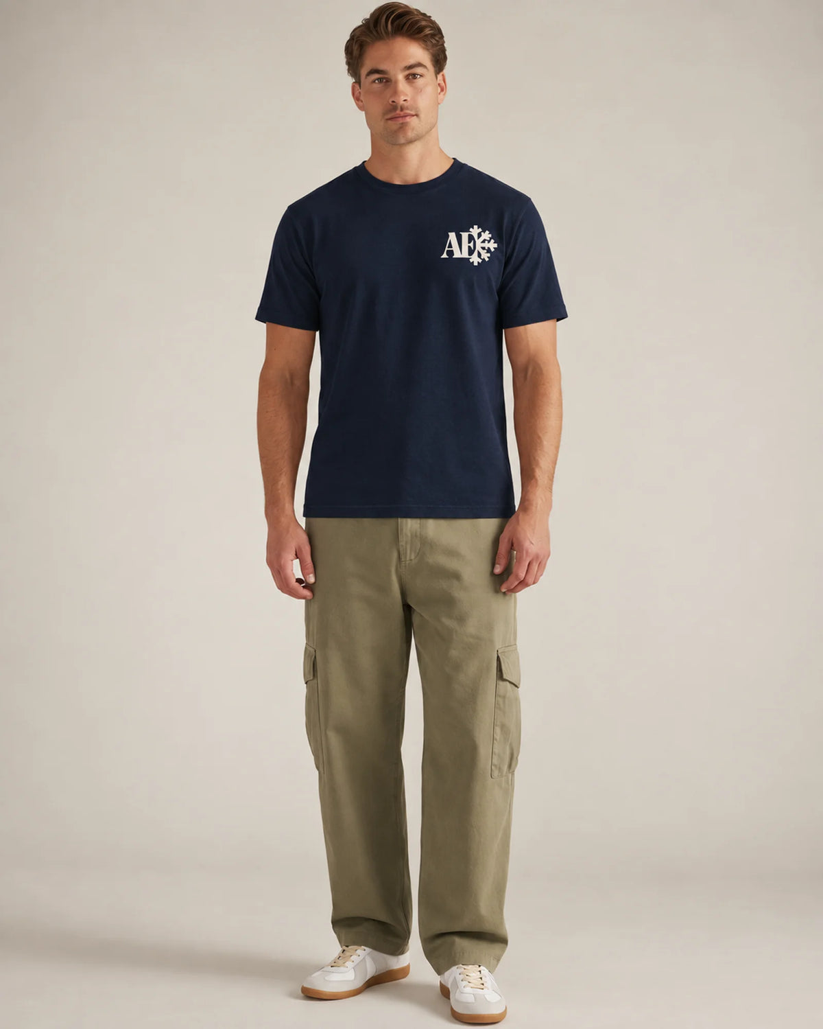 Studio model wearing the navy Snowflake tee, front view