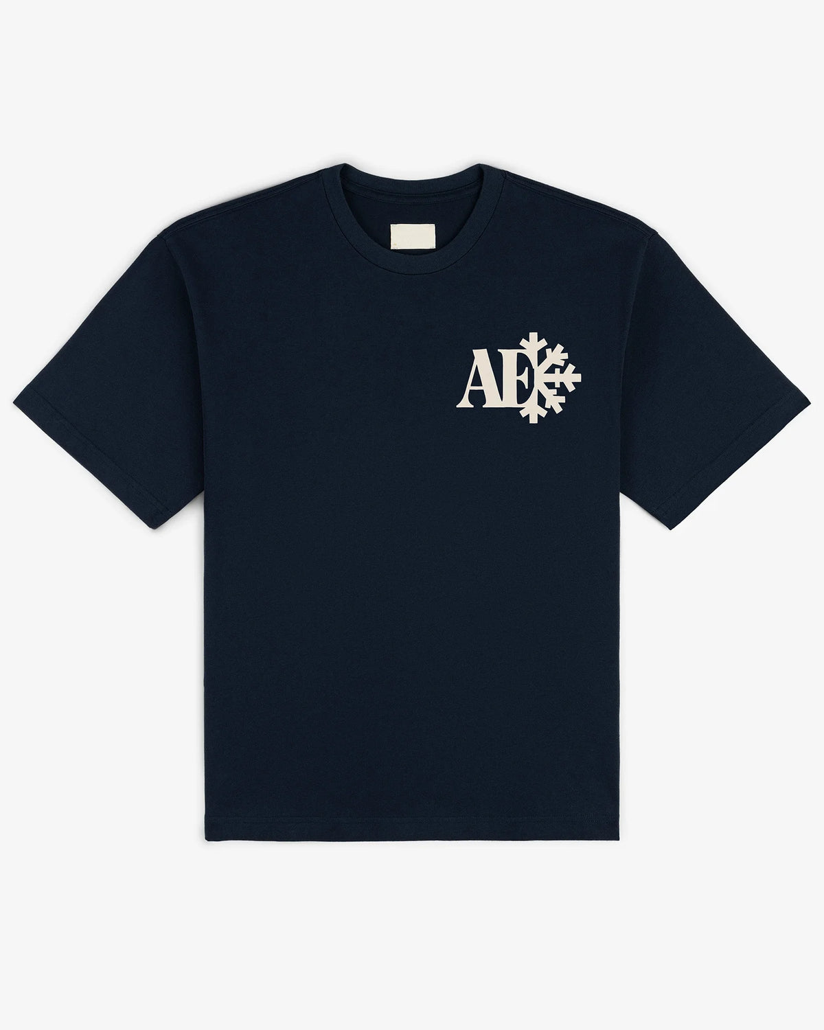 Snowflake tee in navy, flat lay front view with cream monogram snowflake chest print