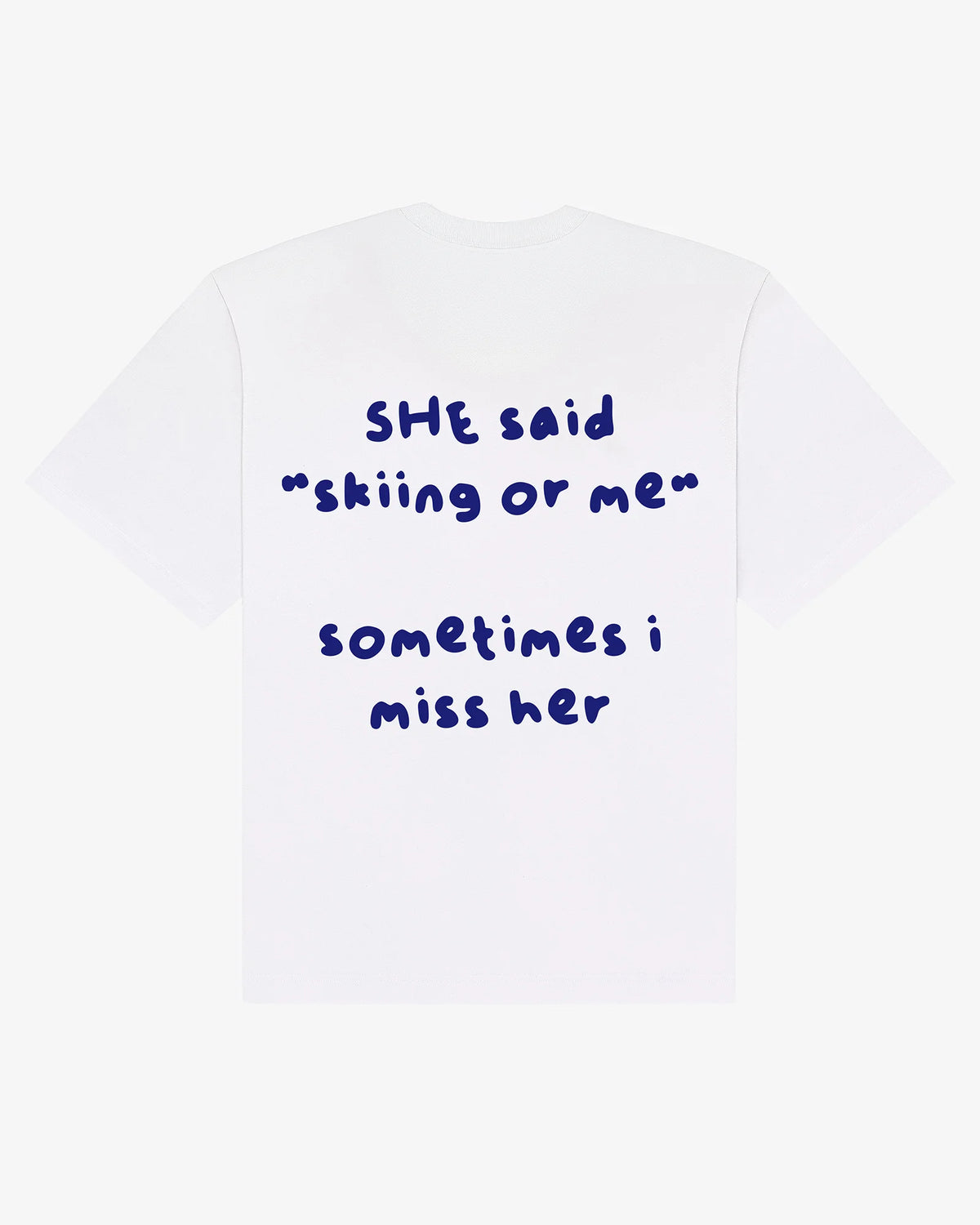 Skiing or Me tee in white, flat lay back view with hand-drawn she said skiing or me graphic
