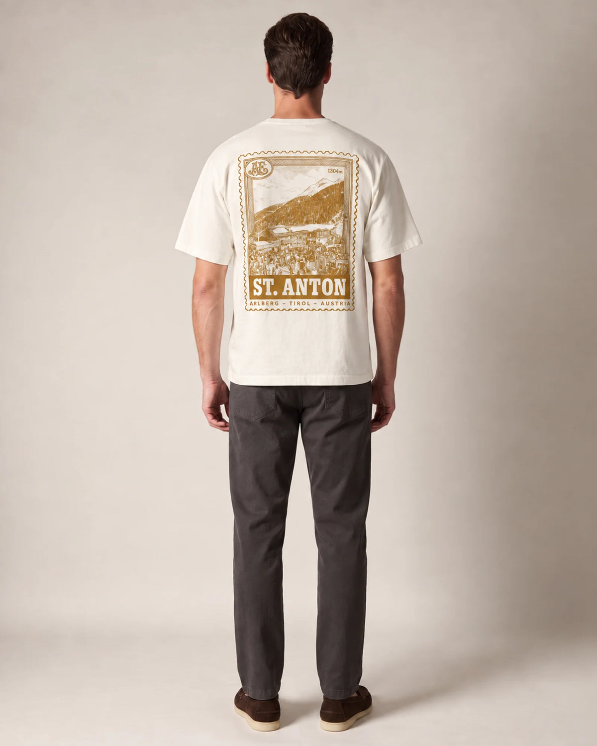 Studio model wearing the ecru St Anton tee, back view