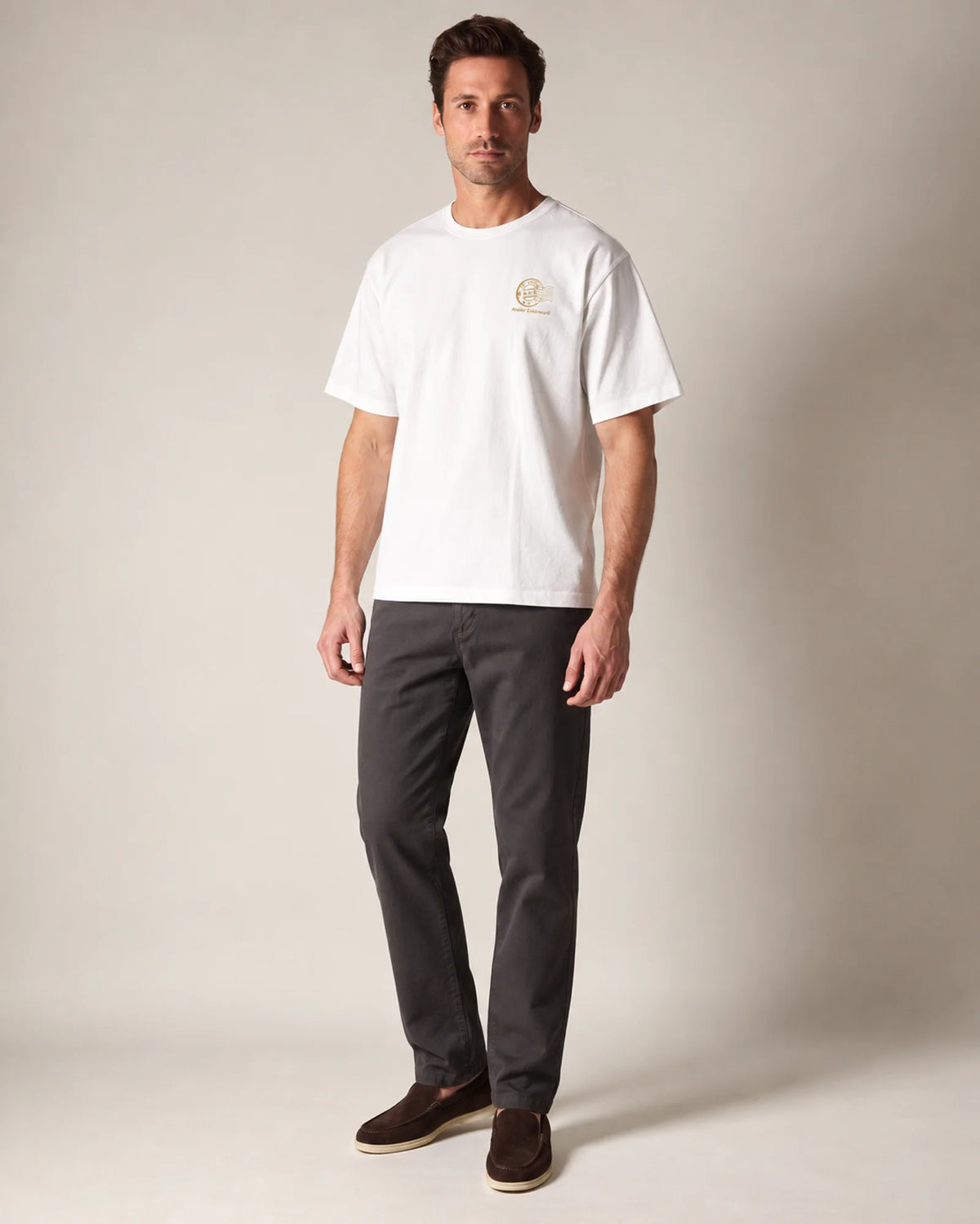Studio model wearing the white St Anton tee, front view
