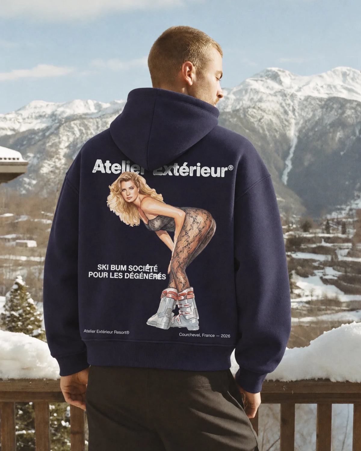 Man wearing the Tanya Hoodie in navy, on location